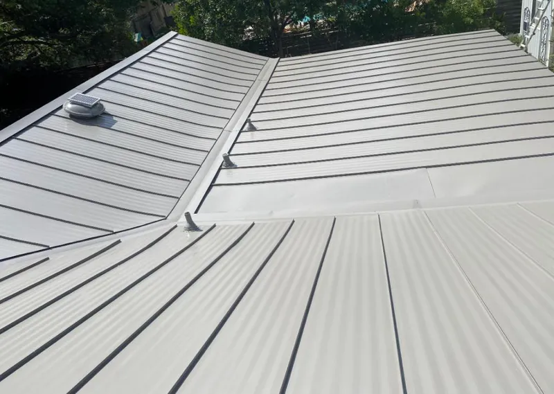 Solar attic fan installed on a metal roof for Roof Ventilation in District Heights